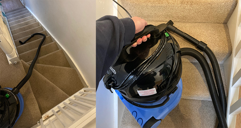 A Charles vacuum being used to clean a staircase