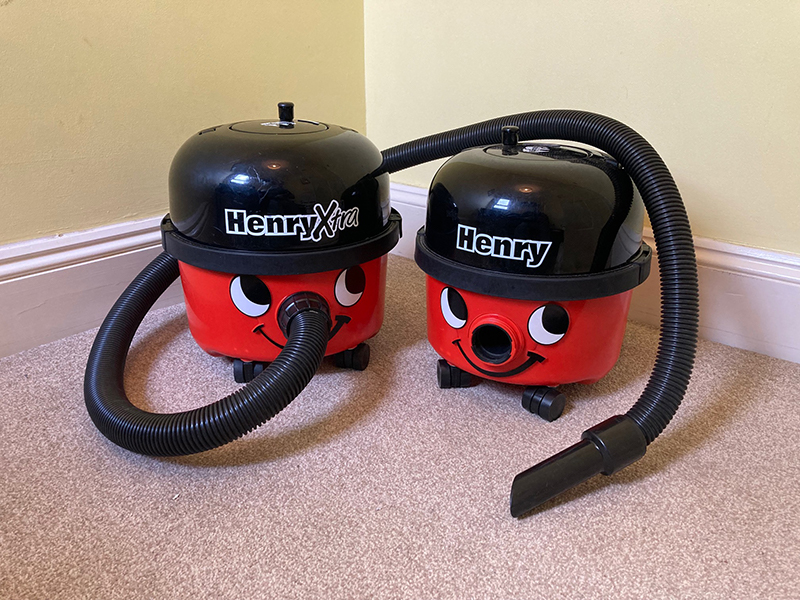 The Henry Xtra vacuum cleaner next to a Henry vacuum cleaner