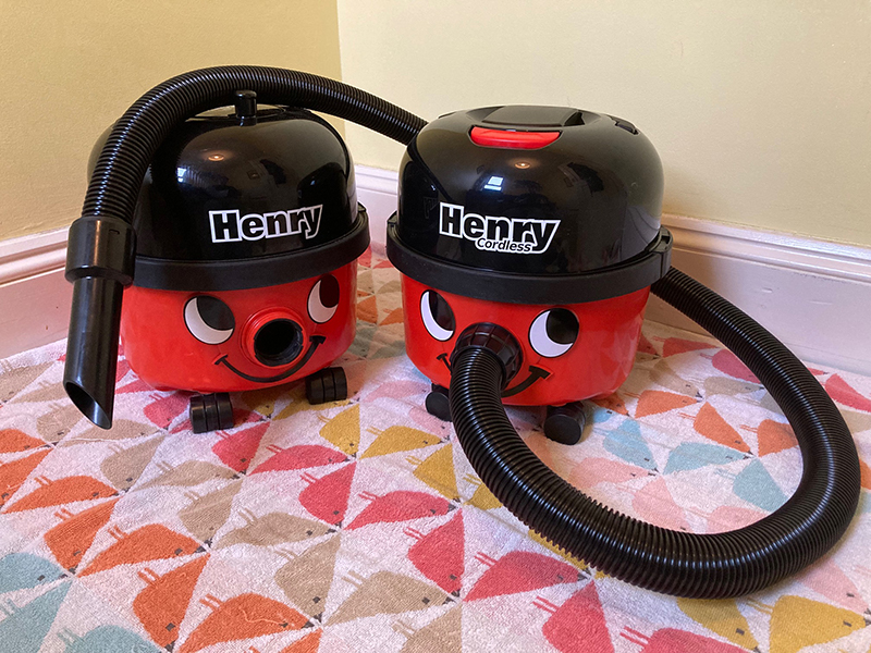 The Henry Cordless next to the original Henry Vacuum.