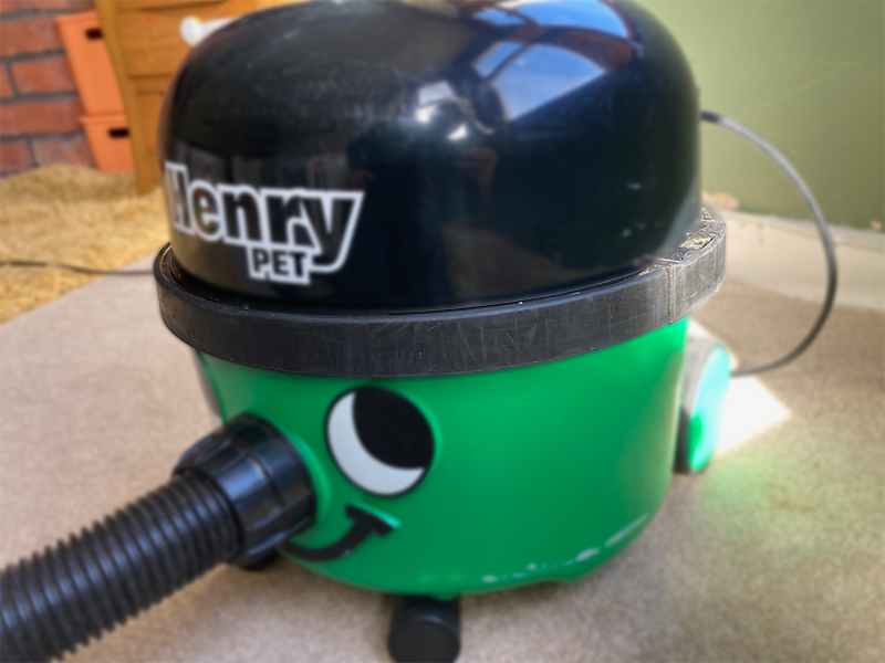 The rubber buffer that runs around the circumference of the Henry Pet vacuum cleaner.