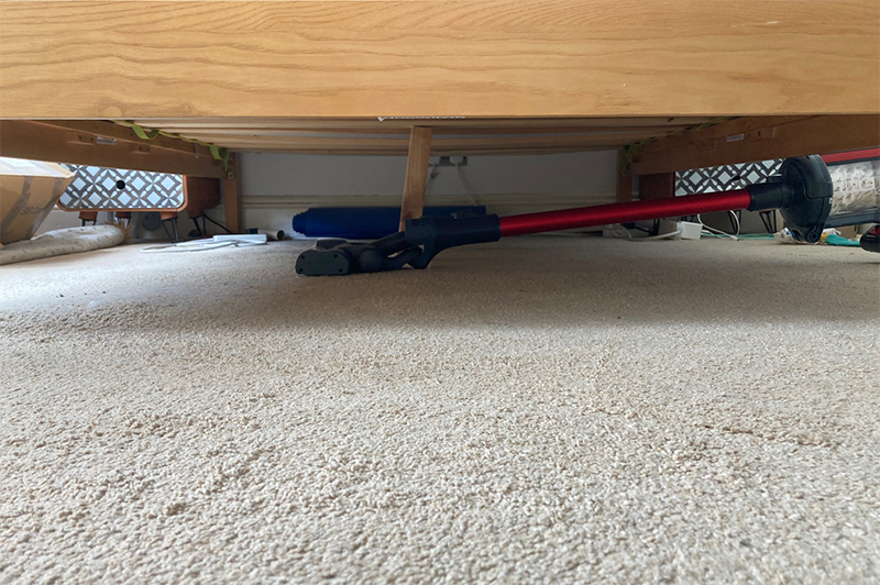 Henry Quick reach underneath a double bed