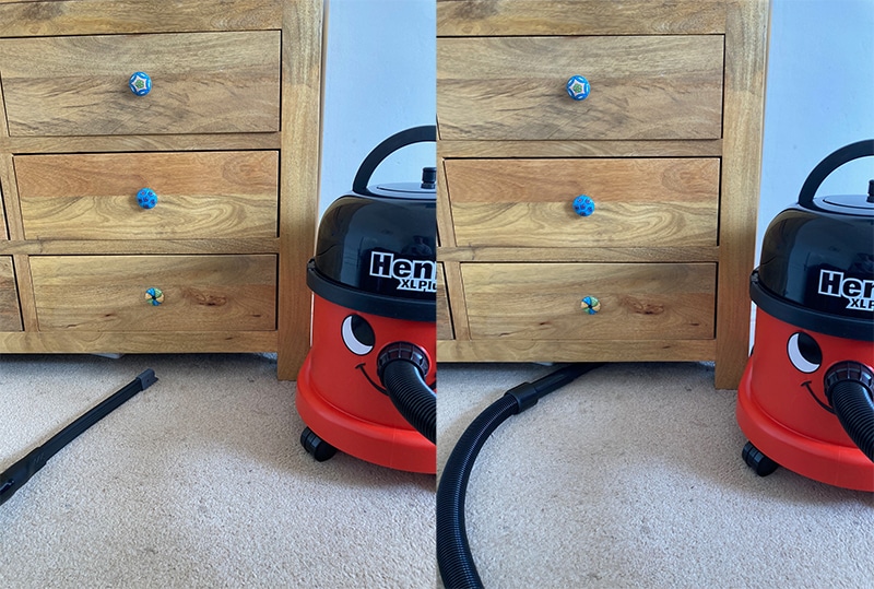 Henry XL Plus' flexi crevice tool cleaning underneath chest of drawers