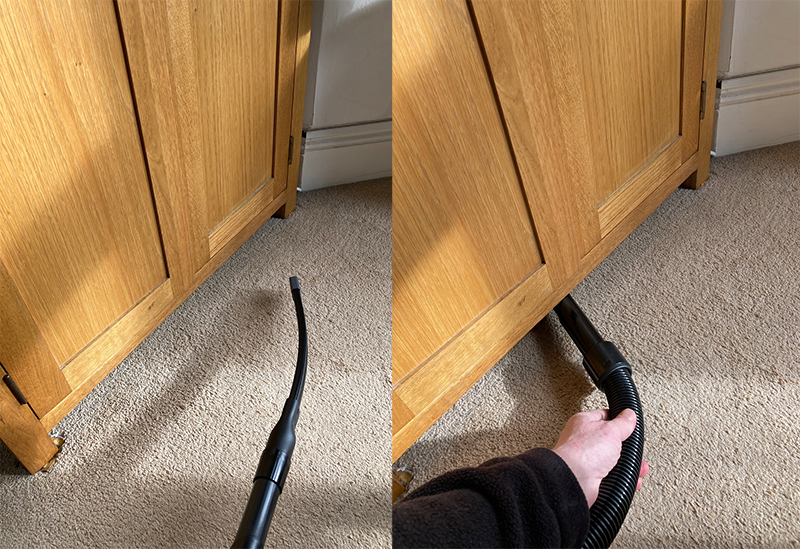 Henry Home flexi crevice tool being used to vacuum underneath a wardrobe